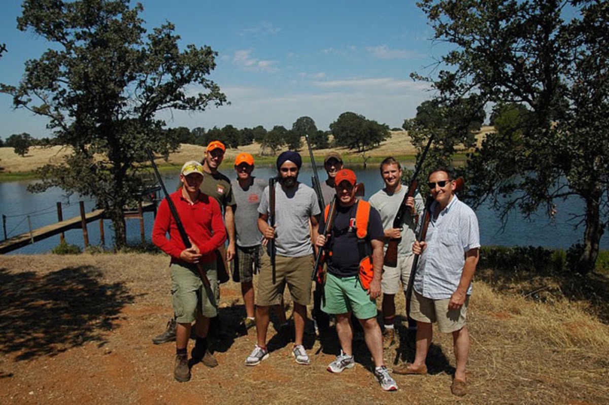A hunting party at a pond